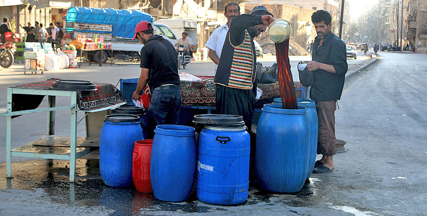 A man buys Sous, a traditional Ramadan drink during the fasting month, in Aleppo, Syria, on Tuesday (Reuters photo )