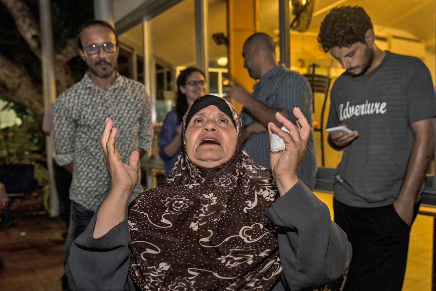 Mazoza Allan, mother of Palestinian hunger striker Mohammed Allan, reacts to a supreme court decision outside Barzilai Hospital in Ashkelon, southern Israel, on Wednesday. Israel’s supreme court on Wednesday suspended the detention order for Allan who has been on a hunger strike for more than two months, releasing him while he receives medical care in a decision hailed by relatives and supporters as a victory (AP photo by Tsafrir Abayov)