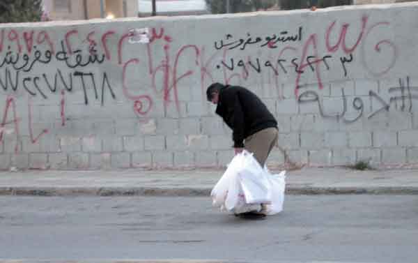 A man stocks up, on Wednesday before the expected rainfall. The Greater Amman Municipality also issued an alert on Wednesday to deal with the expected emergencies (Photo courtesy of Osama Aqarbeh)