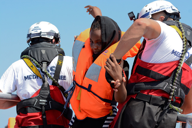 A woman is rescued by SOS Mediterranee organisation and Doctors Without Borders during a search and rescue operation with the MV Aquarius rescue ship in the Mediterranean Sea, off the Libyan Coast,on Friday (Reuters photo)