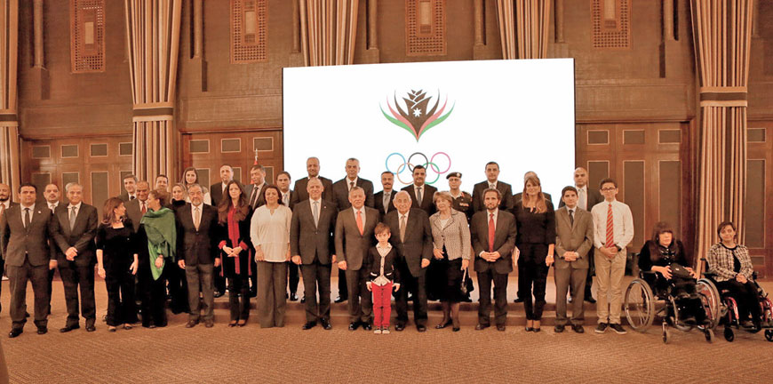 His Majesty King Abdullah poses for a group photo during a ceremony to honour HRH Prince Raad for his contributions for the service of people with disabilities at Al Husseiniya Palace on Wednesday (Photo courtesy of Royal Court)