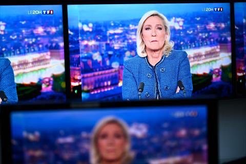 President of the far-right Rassemblement National (RN) parliamentary group Marine Le Pen is seen on monitors during a televised interview broadcasted on the evening news of French TV channel TF1, in Paris, on March 31, 2025 (AFP photo)