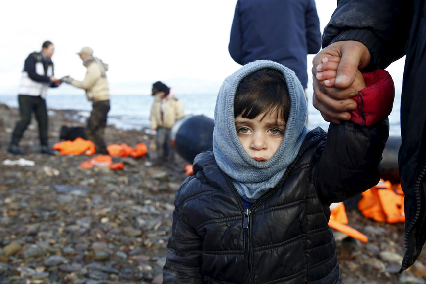 A Syrian refugee child looks on, moments after arriving on a raft with other Syrian refugees on a beach on the Greek island of Lesbos on Monday. Jordan says it has taken a large portion of the refugee burden off Europe and the rest of the world (Reuters photo by Giorgos Moutafis)