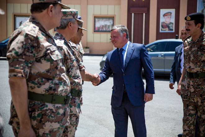 His Majesty King Abdullah is received by top officers at army headquarters on Thursday  (Photo courtesy of Royal Court)