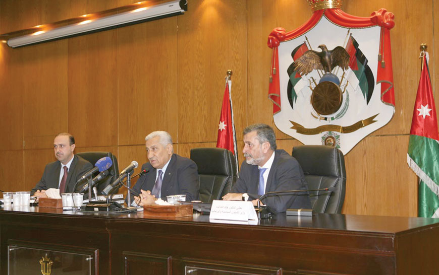 Prime Minister Abdullah Ensour speaks to reporters on Monday at a press conference at the Prime Ministry attended by Government Spokesperson Mohammad Momani and Political and Parliamentary Affairs Minister Khaled Kalaldeh (Petra photo)