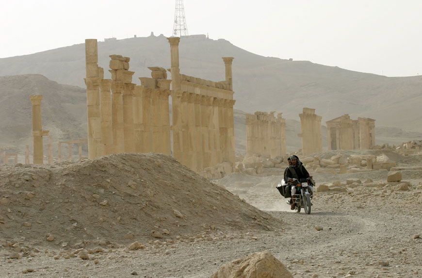 Men ride a motorbike in the historical city of Palmyra, Syria, June 11, 2009 (Reuters photo)