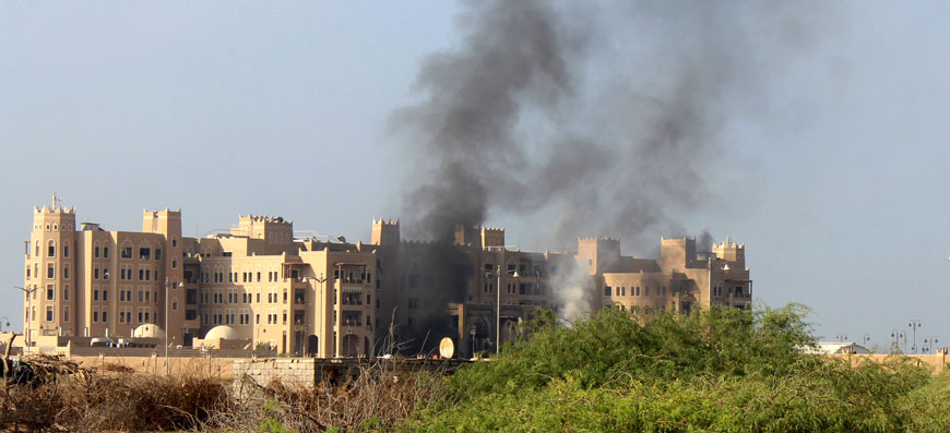 Smoke rises following an explosion that hit Hotel Al Qasr where Cabinet members and other government officials are staying in the southern port city of Aden, Yemen, Tuesday (AP photo by Wael Qubady)