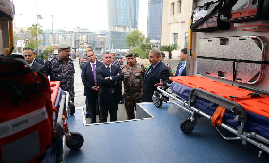His Majesty King Abdullah checks on an ambulance during a visit to the headquarters of the Civil Defence Department in Amman on Monday (Photo courtesy of Royal Court)