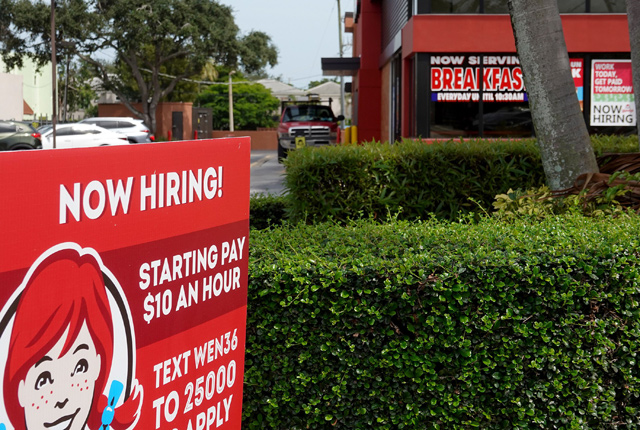 A 'now hiring' sign is seen outside of a business on Friday, in Miami, Florida (AFP photo)