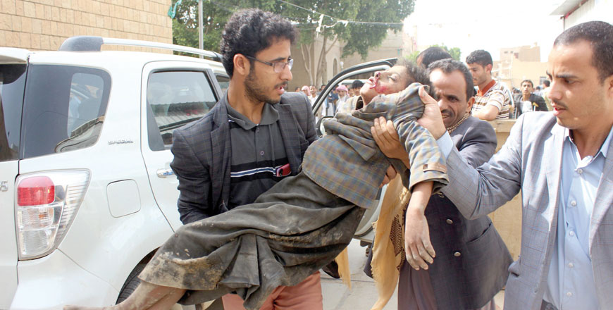 A Yemeni child is transported to a hospital after being wounded in a reported air strike on the Iran-backed Houthi rebels' stronghold province of Saada on Thursday (AFP Photo)