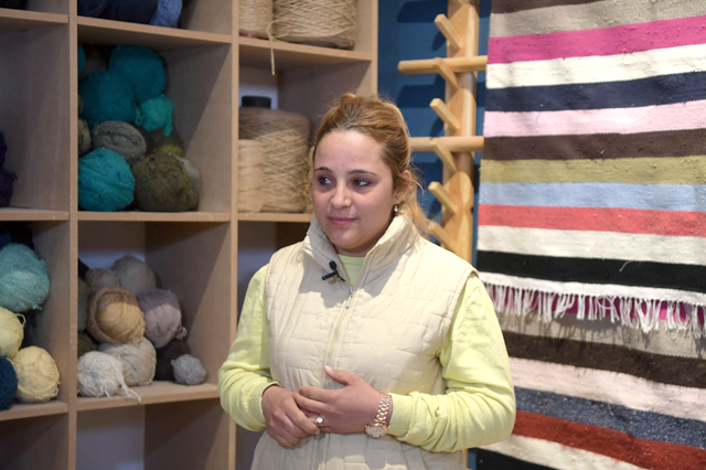 Fatima Alhamal, the local coordinator for Shanti, a social enterprise that helps artisans from across the North African country, is pictured at the rug weaving workshop in the southwestern Tunisian oasis of Nefta, on February 12 (AFP photo)