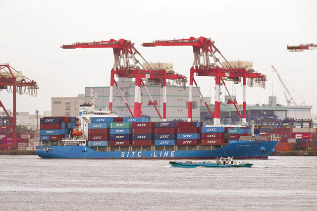 A cargo ship arrives at the international cargo terminal at the port of Tokyo, on Monday (AFP photo)