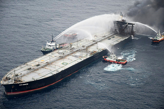 This photo taken on Tuesday shows fireboats battling to extinguish a fire on the Panamanian-registered crude oil tanker New Diamond, some 60km off Sri Lanka's eastern coast where a fire was reported inside the engine room (AFP photo)