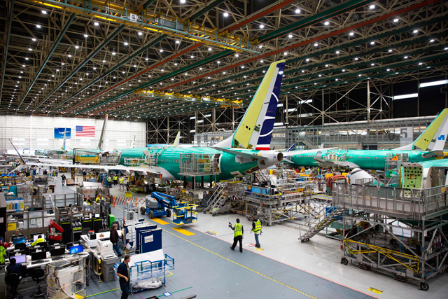 In this file photo taken on March 27, 2019, employees work on Boeing 737 MAX aircraft at the Boeing Renton Factory in Renton, Washington State. (AFP photo)