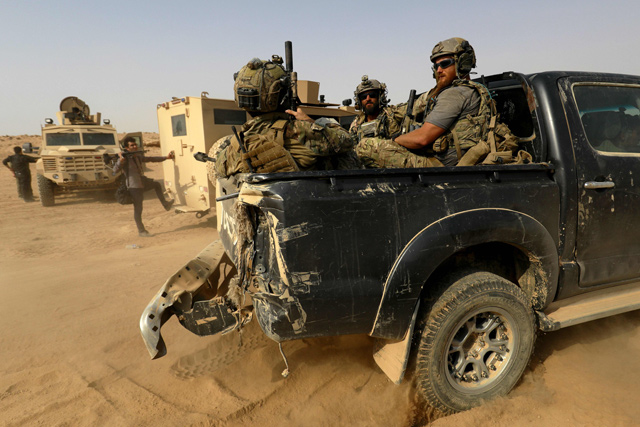 US-backed forces are pictured near the village of Susah in the eastern province of Deir Ezzor, near the Syrian border with Iraq, on September 13 (AFP file photo)
