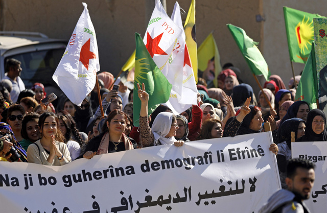 Syrian protesters, mainly Kurds, chant slogans during a demonstration in the town of Al Qahtaniyah, in the Hasakeh province near the Syrian-Turkish border on Thursday against Turkish attacks on Kurdish militia posts in northern Syria (AFP photo)