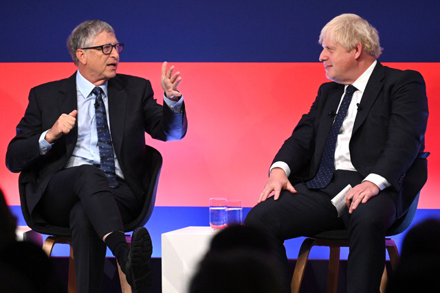 Britain's Prime Minister Boris Johnson (right) and Microsoft founder-turned-philanthropist Bill Gates have a discussion on stage during the Global Investment Summit at the Science Museum in London, on Tuesday (AFP photo)
