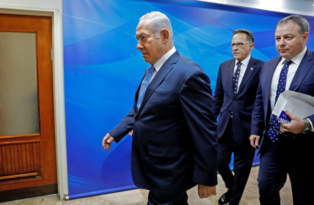 Israeli Prime Minister Benjamin Netanyahu (left) arrives to the weekly Cabinet meeting in occupied Jerusalem on Wednesday (Reuters photo)