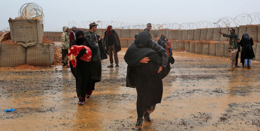 Syrian refugee patients from the makeshift Rukban camp, which lies in no-man's-land off the border between Syria and Jordan in the remote northeast, cross over to visit a UN-operated medical clinic immediately on the Jordanian-side for checkups, on March 1, 2017 (AFP photo)