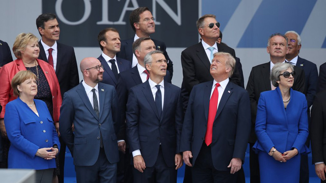 US President Donald Trump and leaders of the North Atlantic Treaty Organisation member states pose for a photo during the Brussels convention on July 11 (Photo courtesy of Time Magazine)