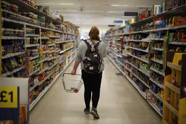 A shopper browses an aisle for groceries at a Tesco Superstore in south London, on September 30, 2019 (AFP file photo)