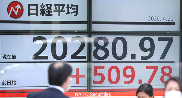 An electronic quotation board displays share prices of the Tokyo Stock Exchange in Tokyo on April 30 (AFP photo)