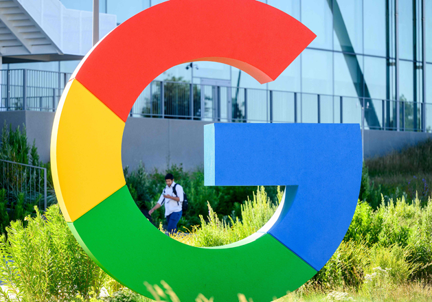 A worker walks along a path at Google’s Bay View campus in Mountain View, California on June 27, 2022 (AFP photo)