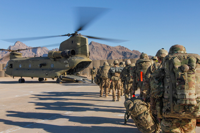 Soldiers attached to the 101st Resolute Support Sustainment Brigade, Iowa National Guard and 10th Mountain, 2-14 Infantry Battalion, load onto a Chinook helicopter to head out on a mission in Afghanistan, on January 15 (Reuters photo)