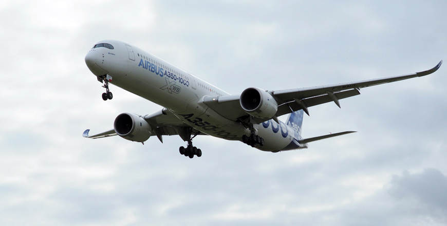 In this file photo taken on February 8, an Airbus A350-1000 conducts a test flight over Chateauroux Airport, central France (AFP photo)