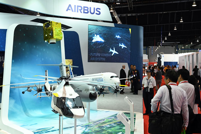 Visitors look at an Airbus model display at the Singapore Airshow in Singapore, on Wednesday (AFP photo)