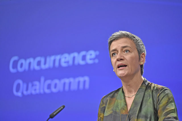 EU Competition Commissioner Margrethe Vestager gives a joint press conference at the EU headquarters in Brussels, on Wednesday, as the EU hit US chipmaking giant Qualcomm with an antitrust fine of 997 million euros for paying Apple to use its chips exclusively in iPhones and iPads (AFP photo)