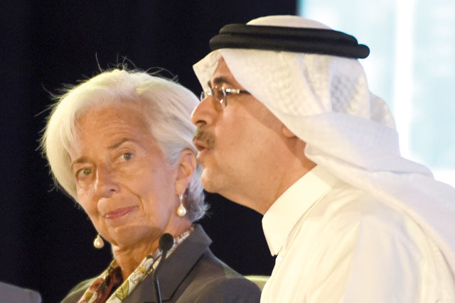 Managing Director of International Monetary Fund Christine Lagarde (left) looks at the President and CEO of the Saudi Oil Company Aramco Amin Nasser (right) as he speaks during the Future Investment Initiative (FII) conference in Riyadh on Tuesday (AFP photo)