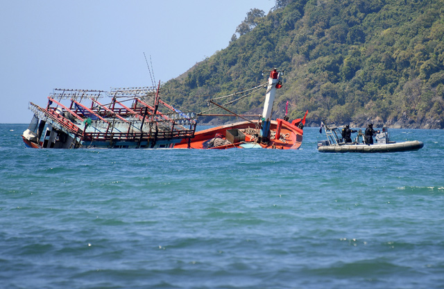 Police inspect a sunken vessel at Cape Kimberley, located near the the Daintree River in northern Queensland, Australia, on Tuesday  (Reuters photo)