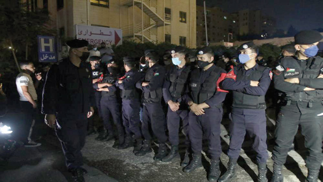 Police stand guard outside Gardens Hospital in the early hours of Sunday (JT photo)