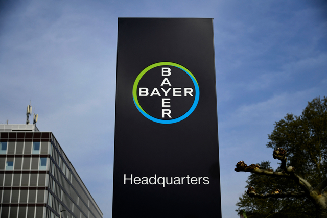 A photo taken on April 23, 2019 shows a board bearing the logo of German chemicals and pharmaceuticals giant Bayer at the group's headquarters in Leverkusen, western Germany (AFP photo)