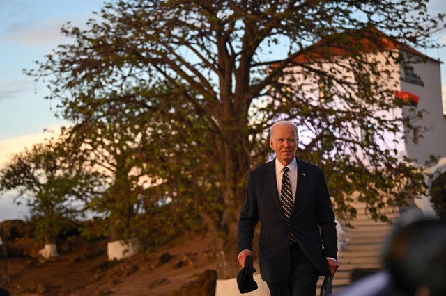 US President Joe Biden leaves after visiting the National Slavery Museum in Morro da Cruz, near Luanda, on Tuesday (AFP photo)