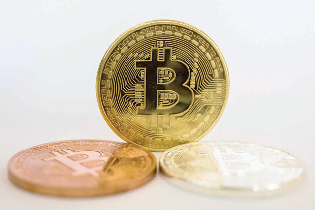 Bitcoin briefly rose above $60,000 for the first time on Saturday (AFP photo)