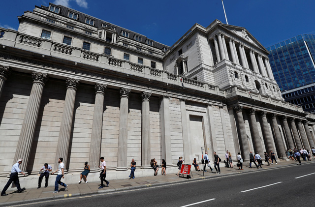 People walk past the Bank of England in London, Britain, on Wednesday (Reuters photo)