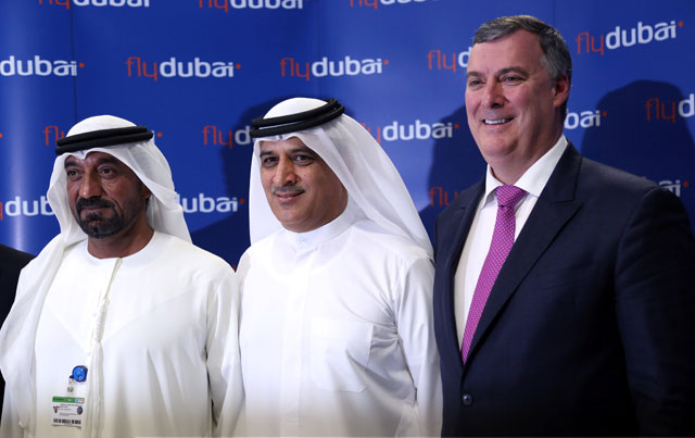 Emirates Chairman Sheikh Ahmed Bin Saeed Al Maktoum, Flydubai Chief Executive Ghaith Al Ghaith, and Boeing Commercial Airplanes President and Chief Executive Kevin McAllister pose during a news conference at the Dubai Airshow in Dubai, UAE, on Wednesday  (Reuters photo)