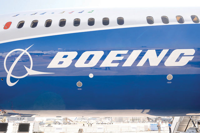 This photo taken on June 18, 2017 shows the Boeing logo on the fuselage of a Boeing 787-10 Dreamliner test plane presented on the Tarmac of Le Bourget on the eve of the opening of the International Paris Air Show (AFP photo)