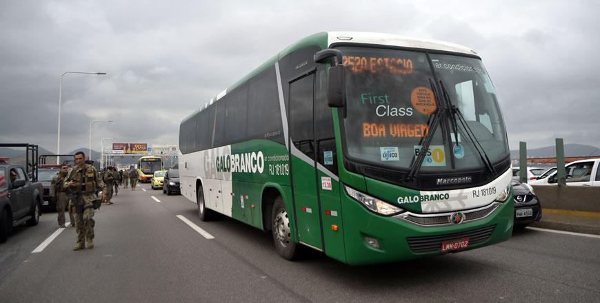 The bus in which a gunman held 31 hostages before being shot dead by police is being taken away, in Rio de Janeiro, Brazil, on Tuesday  (AFP photo)
