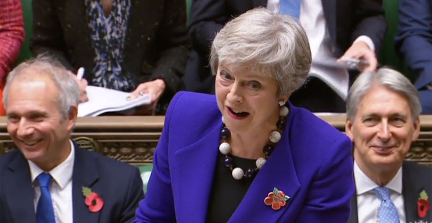 A video grab from footage broadcast by the UK Parliament's Parliamentary Recording Unit shows Britain's Prime Minister Theresa May gestures as she answers a question during the weekly question and answer session in the House of Commons in London on Wednesday  (AFP photo)