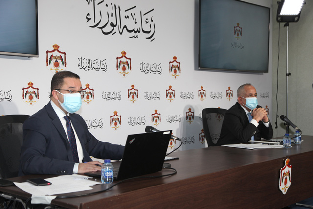 Finance Minister Mohamad Al-Ississ, along with Minister of State and Media Affairs Ali Al Ayed, speaks during a press conferince at the Prime Ministry on Monday (Petra photo)