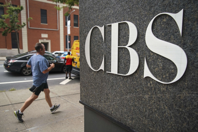 A man jogs past the CBS Broadcast Centre, on Tuesday, in New York City (AFP photo)