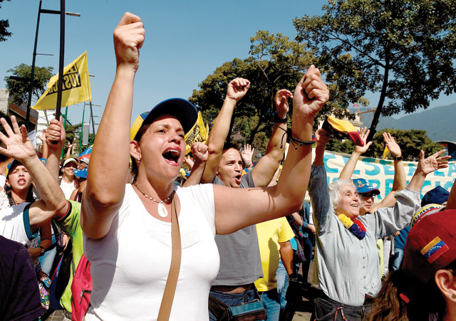 Opposition activists pour to the streets to back Venezuelan opposition leader Juan Guaido's calls for early elections in Caracas on Saturday (AFP photo)