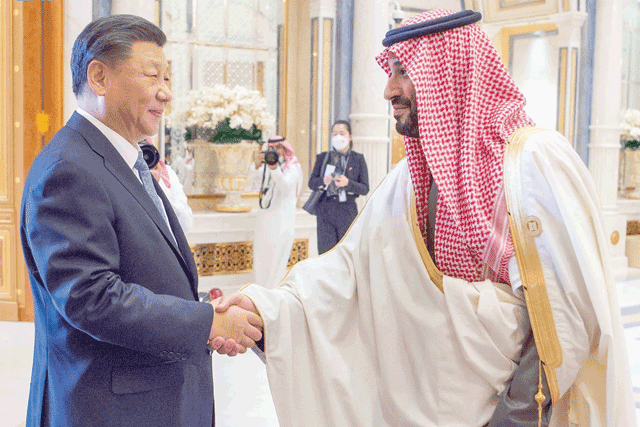 This handout photo released by the Saudi Press Agency SPA shows Saudi Crown Prince Mohammed Bin Salman shaking hands with Chinese President Xi Jinping during the China-Arab summit in the Saudi capital Riyadh on Friday (AFP photo/HO/SPA)