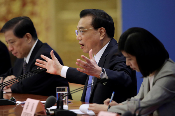 Chinese Premier Li Keqiang speaks at a news conference following the closing session of the National People's Congress at the Great Hall of the People in Beijing, China, on Friday  (Reuters photo)