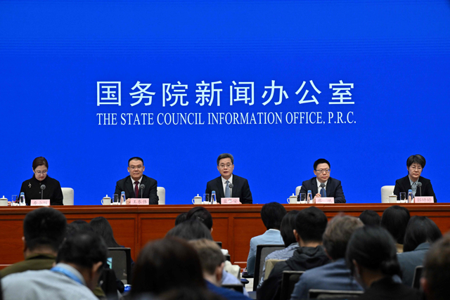 China's Finance Minister Lan Foan speaks next to Vice Minister of Finance Wang Dongwei, Vice Minister of Finance Liao Min and Vice Minister of Finance Guo Tingting during a press conference in Beijing on Saturday  (AFP photo)
