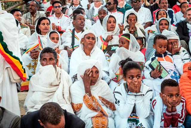 People react after a structure holding people collapsed, trapping and injuring dozens of them during the celebration of Timkat, the Ethiopian Epiphany, in Gondar, Ethiopia, on Monday (AFP photo)