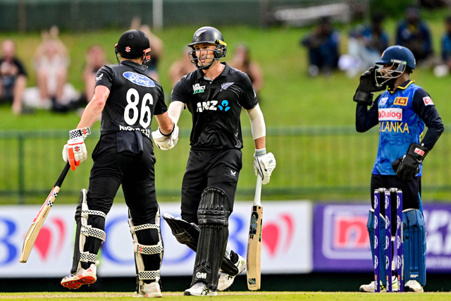 New Zealand's Will Young (centre) celebrates with Henry Nicholls (left) after scoring a half-century (50 runs) during the third and final One-Day International (ODI) cricket match between Sri Lanka and New Zealand at the Pallekele International Cricket Stadium in Kandy on Tuesday (AFP photo)